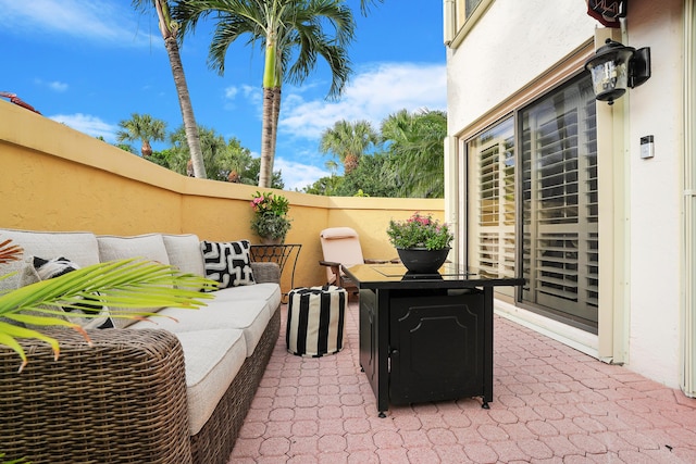 view of patio featuring fence and an outdoor living space