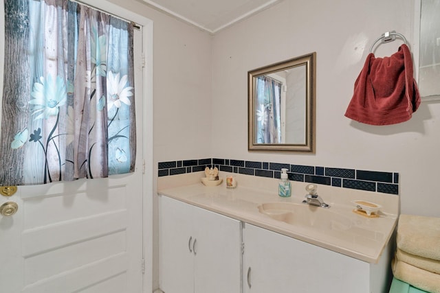 bathroom with vanity and tile walls