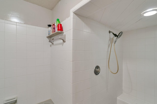 bathroom with a tile shower