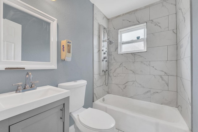 full bathroom featuring toilet, vanity, and tiled shower / bath combo