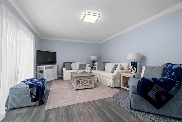 living room featuring a textured ceiling, hardwood / wood-style floors, and ornamental molding