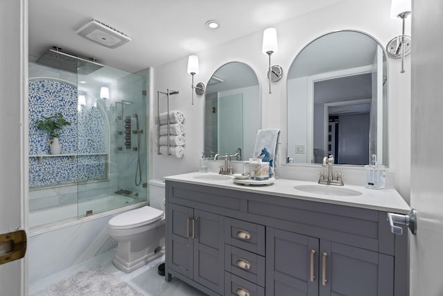 bathroom featuring vanity and combined bath / shower with glass door