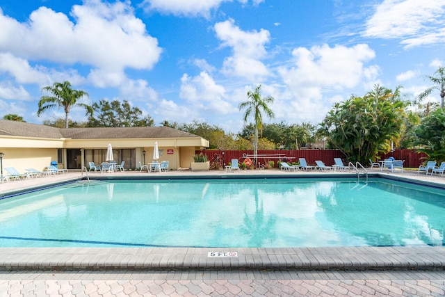 view of swimming pool featuring a patio area