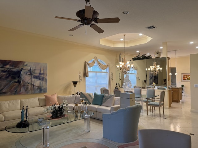 living room with ceiling fan with notable chandelier, crown molding, light tile patterned floors, and a raised ceiling