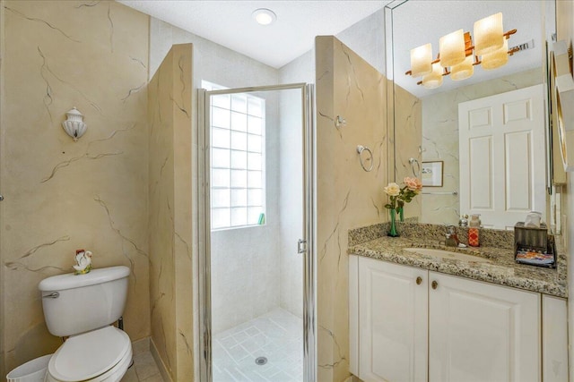 bathroom featuring walk in shower, vanity, and toilet