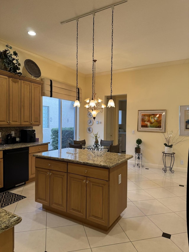 kitchen with decorative light fixtures, dishwasher, light stone countertops, crown molding, and a center island