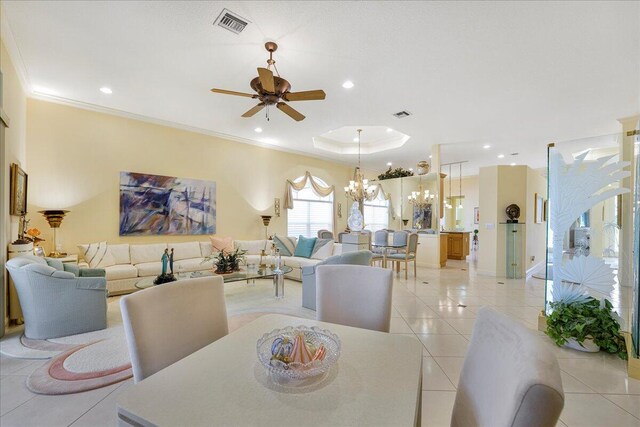 hall with light tile patterned floors, french doors, and a tray ceiling