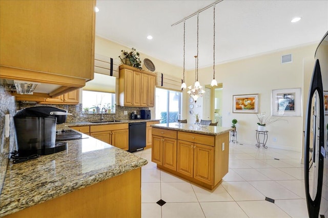 kitchen with a kitchen island, sink, ornamental molding, light stone counters, and black appliances