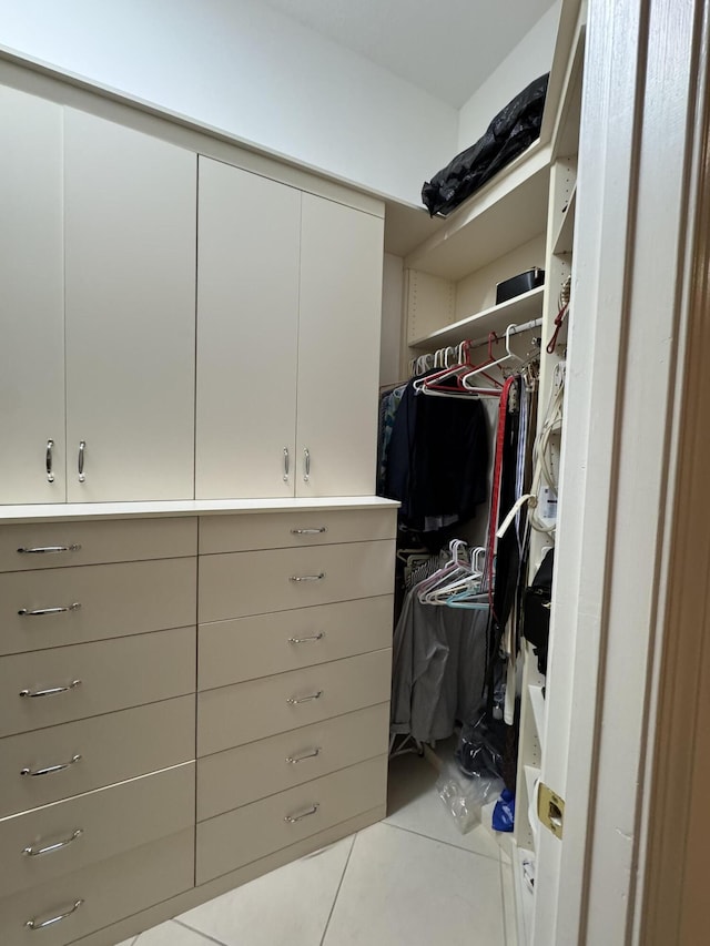 spacious closet featuring light tile patterned flooring