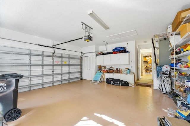 garage featuring a garage door opener