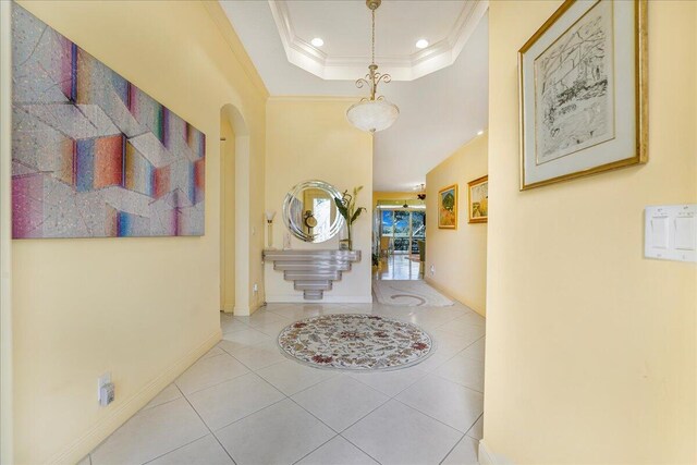 living room featuring ceiling fan, light tile patterned floors, and crown molding