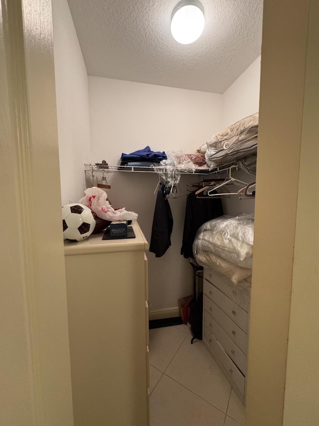 walk in closet featuring light tile patterned floors