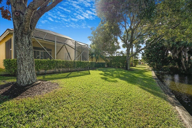 view of yard with a lanai