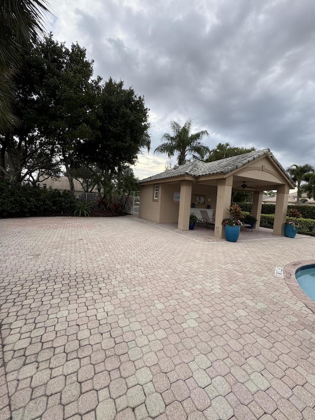 view of property exterior with a patio