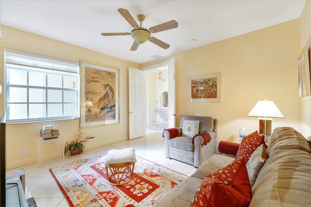 living room with ceiling fan and light tile patterned floors