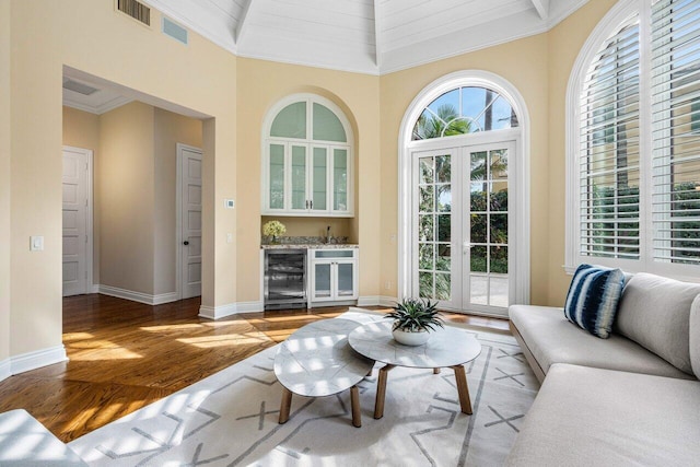 interior space with wine cooler and bar area