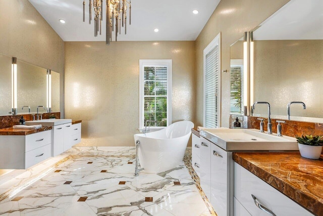 bathroom with a bathing tub and vanity