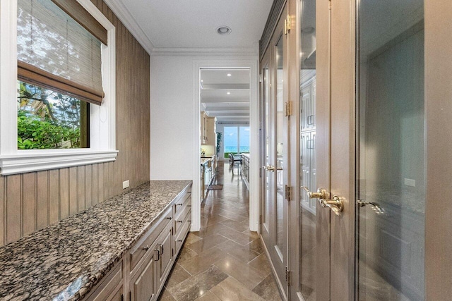 interior space with crown molding and vanity