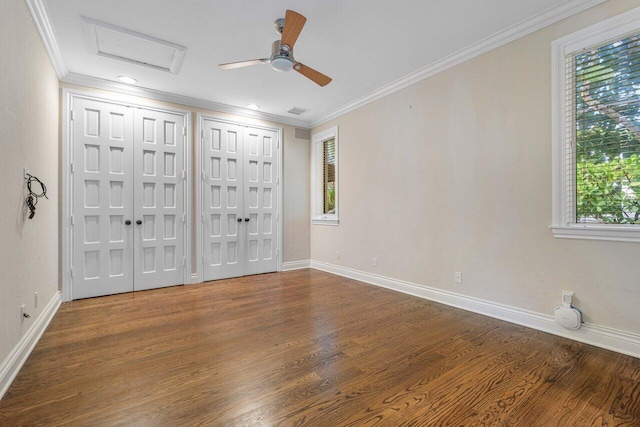 spare room with crown molding, hardwood / wood-style floors, and ceiling fan