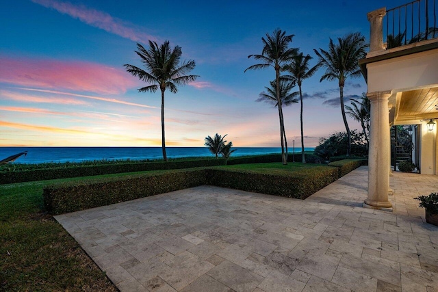 patio terrace at dusk with a water view