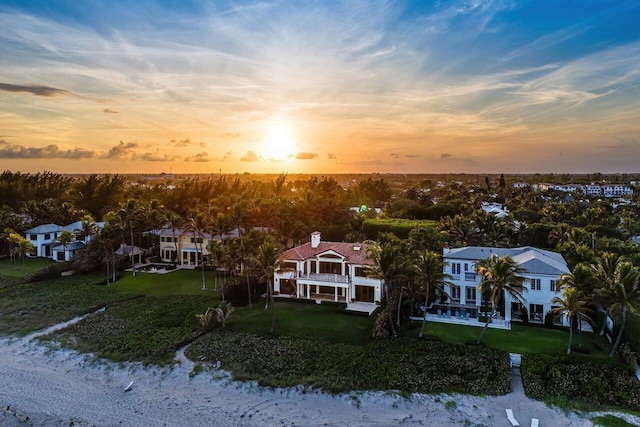 aerial view at dusk with a water view