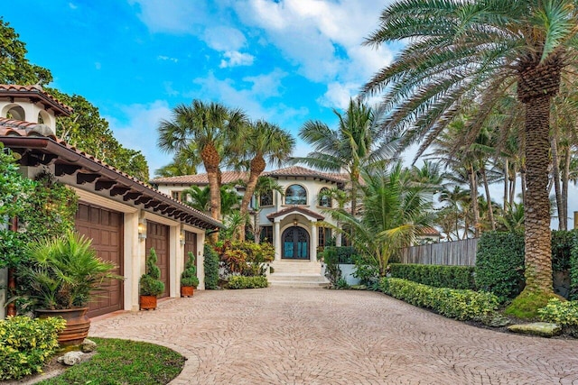 mediterranean / spanish-style house featuring a garage