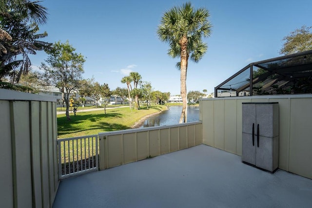 view of patio with a water view