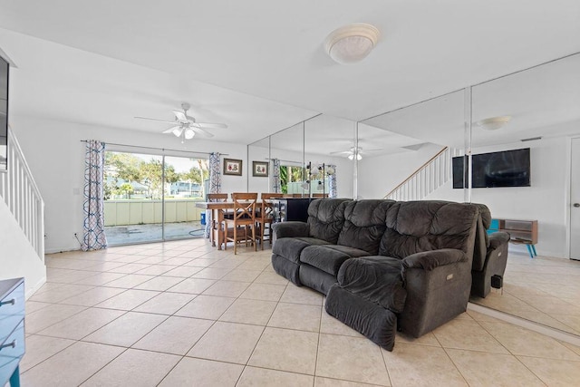 living room featuring ceiling fan and light tile patterned floors