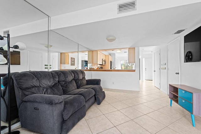 living room with light tile patterned floors