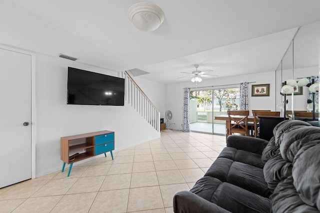 living room with ceiling fan and light tile patterned floors