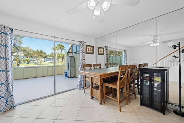 dining room featuring ceiling fan and light tile patterned floors