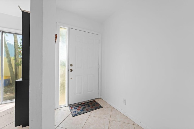 entrance foyer featuring light tile patterned floors