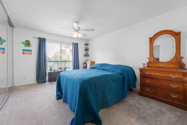 bedroom featuring ceiling fan, light carpet, and access to exterior