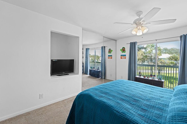 bedroom featuring ceiling fan, a closet, access to exterior, and light colored carpet