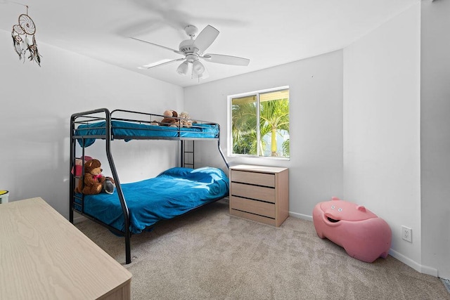 bedroom featuring light carpet and ceiling fan