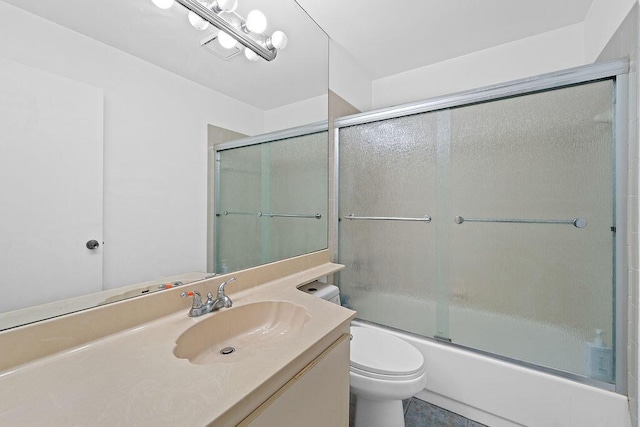 full bathroom with shower / bath combination with glass door, vanity, and toilet