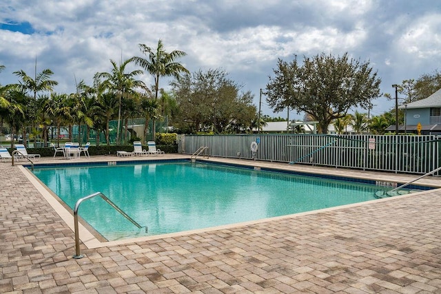 view of swimming pool with a patio