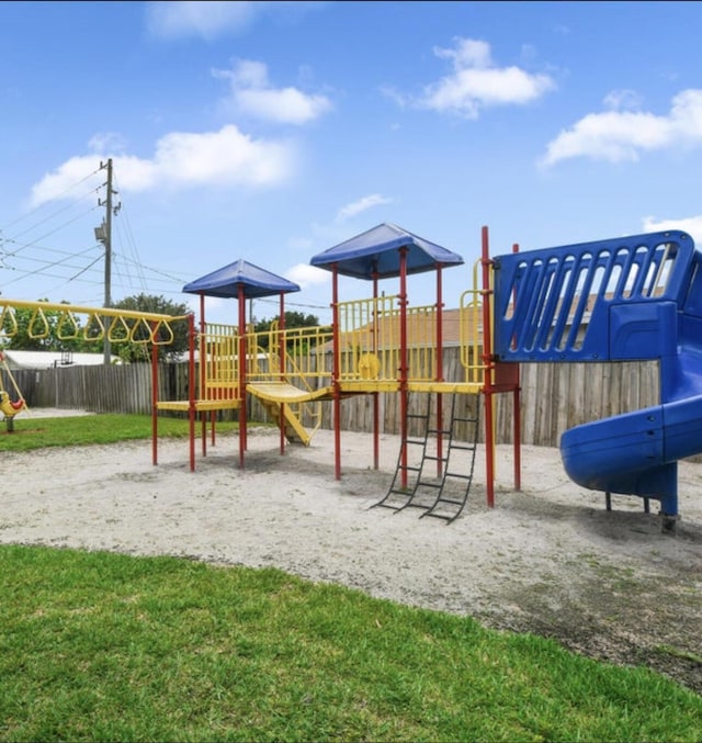 view of jungle gym with a yard