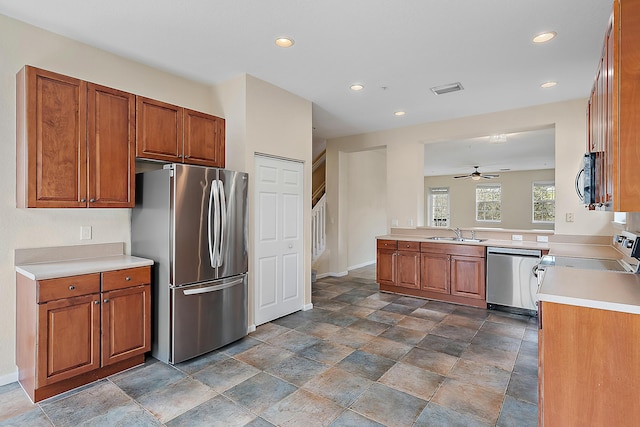 kitchen featuring ceiling fan, sink, and appliances with stainless steel finishes