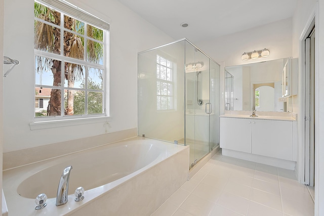 bathroom featuring vanity, tile patterned floors, and shower with separate bathtub