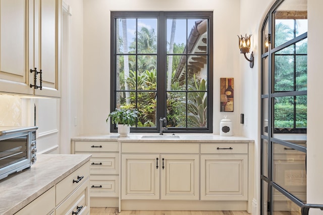 kitchen with cream cabinets and sink