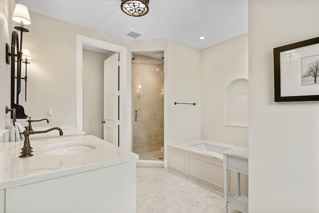 bathroom featuring plus walk in shower and vanity