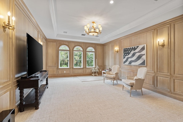 sitting room featuring light carpet, an inviting chandelier, crown molding, and a tray ceiling