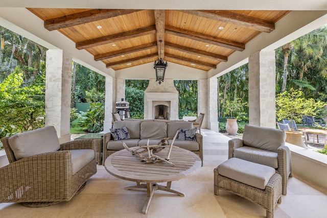 view of patio featuring an outdoor living space with a fireplace