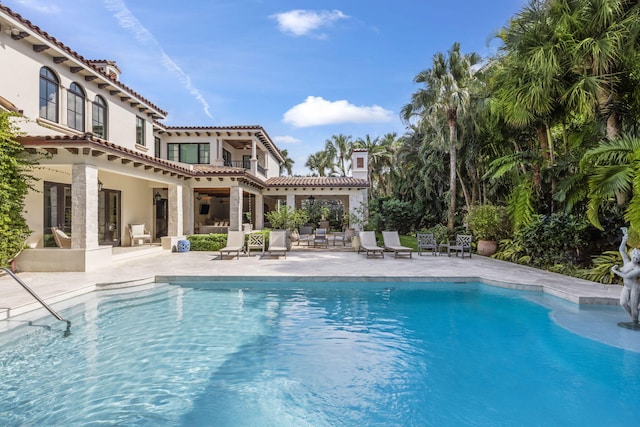 view of pool featuring a patio