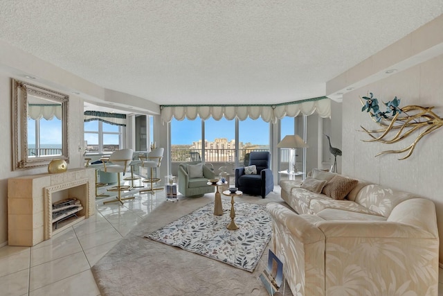 tiled living room with a wealth of natural light and a textured ceiling