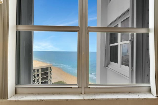 room details with a water view and a view of the beach