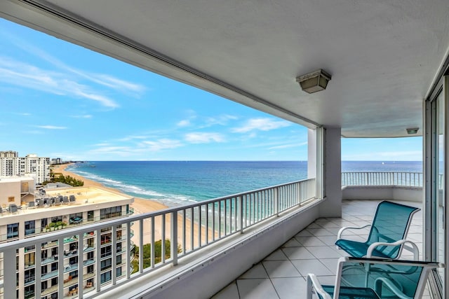 balcony with a view of the beach and a water view