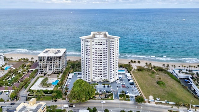 aerial view with a water view and a view of the beach