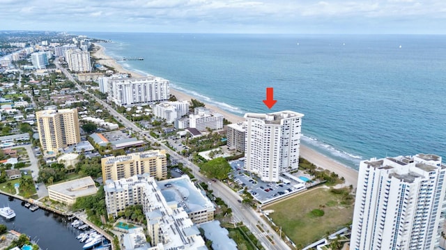 birds eye view of property featuring a view of the beach and a water view